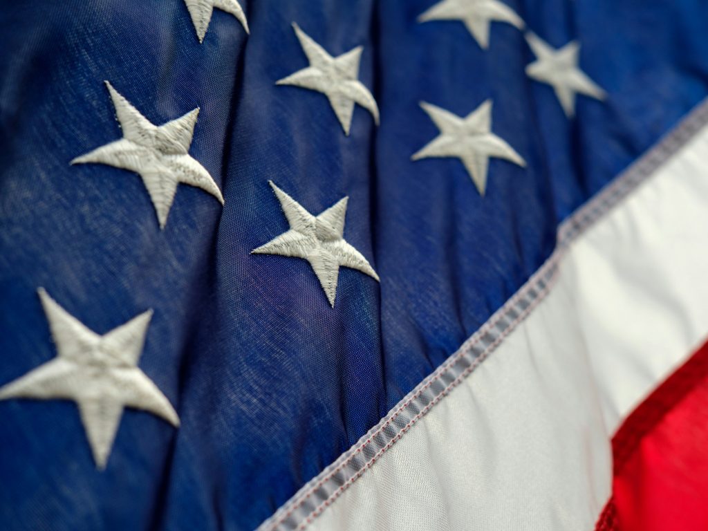 American flag as the White House has released its ‘AI Action Plan’, which Donald Trump and the rest of the government frames the coming decade as a technological race the US cannot afford to lose.