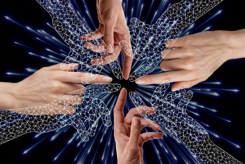 Human and digital hands as generative AI’s experimental phase is concluding, making way for truly autonomous systems in 2026 that act rather than merely summarise.