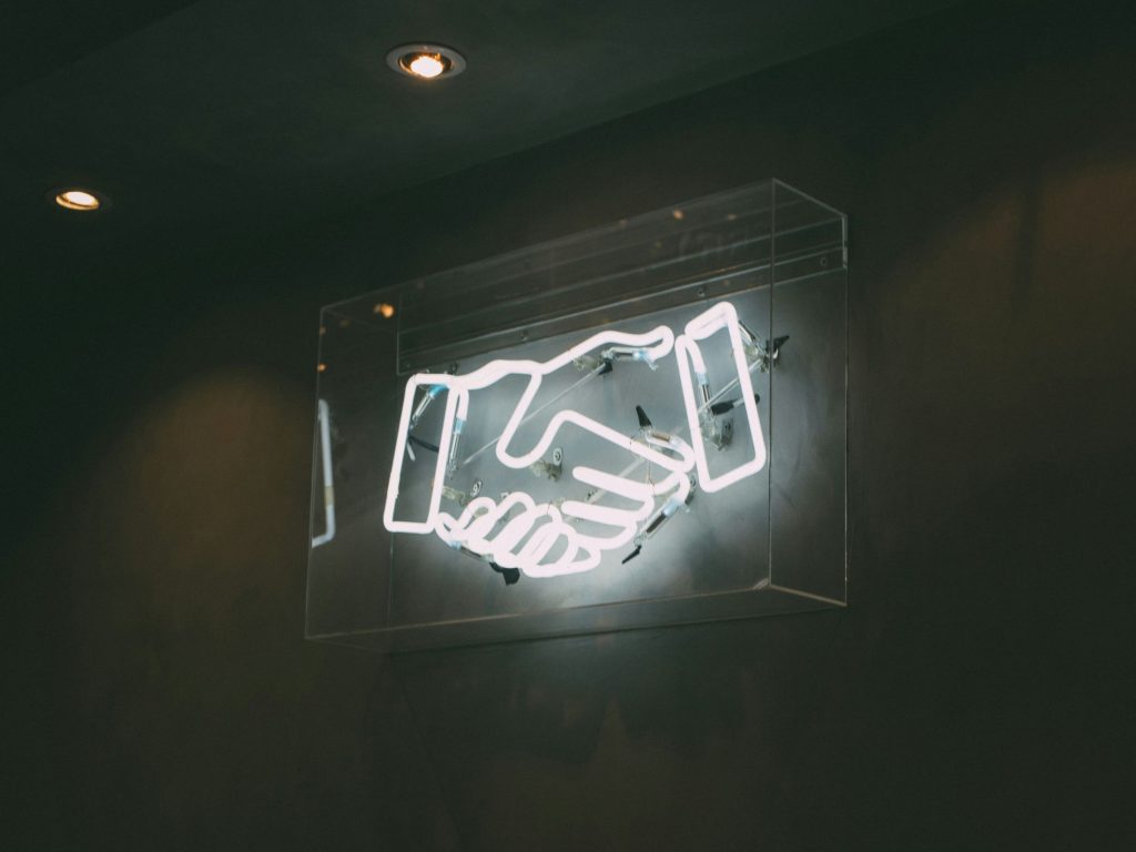 Digital handshake sign as, according to SAP, integrating agentic AI into core human capital management (HCM) modules helps target operational bloat and reduce costs.