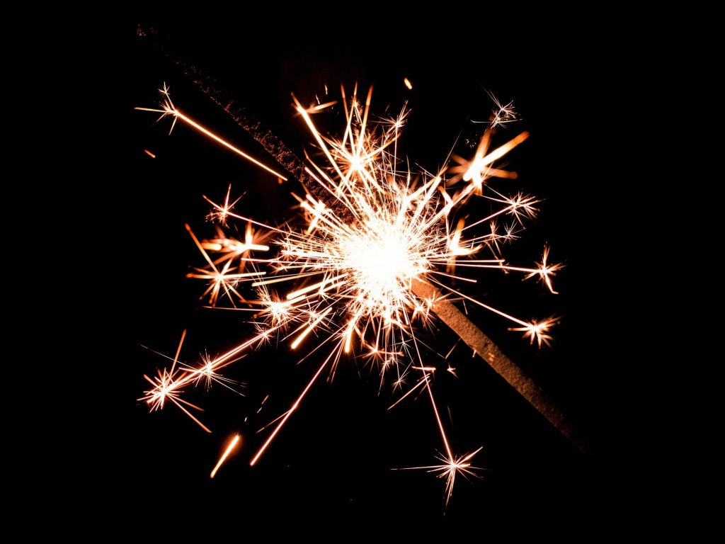 Photo of a sparkler as a report from the Tony Blair Institute calling on the UK government to lead in navigating the complex intersection of arts and AI by adapting copyright laws spark backlash, concerns, and criticism about the impact of generative artificial intelligence models on artists, writers, and other human creativity industries.